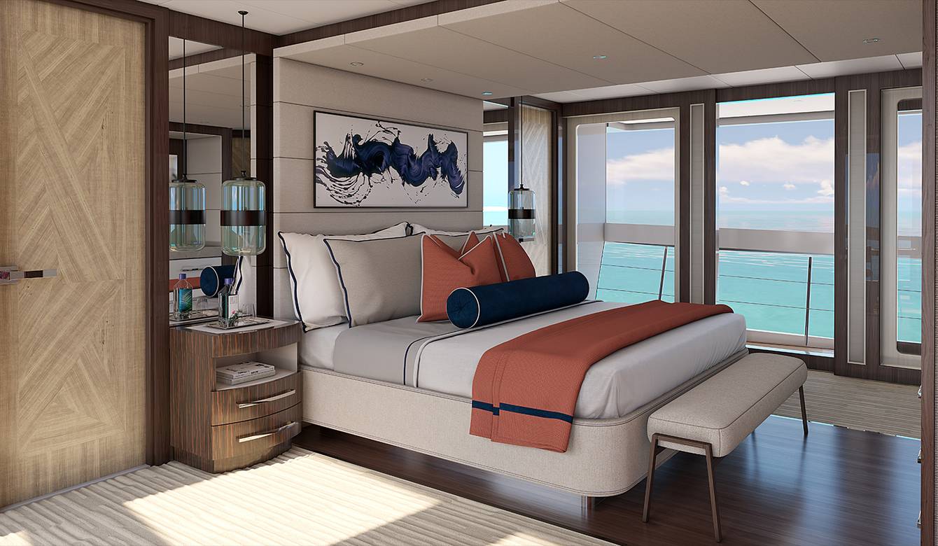 View of bed in bedroom with large windows in background